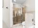 Shower with a tile surround in a clean and modern bathroom, complete with a glass enclosure at 711 Cosmopolitan Ne Dr # 347, Atlanta, GA 30324