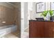 Clean bathroom featuring a shower-tub, tile and a wood vanity with granite countertop at 711 Cosmopolitan Ne Dr # 347, Atlanta, GA 30324