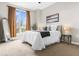 Cozy bedroom with plush carpet, large window with stylish curtains and comfortable bed at 711 Cosmopolitan Ne Dr # 347, Atlanta, GA 30324