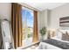 Cozy bedroom with plush carpet, large window with stylish curtains and comfortable bed at 711 Cosmopolitan Ne Dr # 347, Atlanta, GA 30324