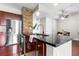 Kitchen featuring stainless steel appliances, a kitchen island, a granite countertop and dark wood cabinets at 711 Cosmopolitan Ne Dr # 347, Atlanta, GA 30324