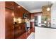 Gourmet kitchen boasting dark wood cabinets, granite countertops, stainless appliances, and stone backsplash at 711 Cosmopolitan Ne Dr # 347, Atlanta, GA 30324