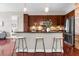 Charming kitchen features stainless steel appliances, breakfast bar, wood cabinets and hardwood flooring at 711 Cosmopolitan Ne Dr # 347, Atlanta, GA 30324