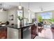 Inviting living space features an open concept kitchen with granite countertops, and hardwood flooring at 711 Cosmopolitan Ne Dr # 347, Atlanta, GA 30324