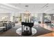 Spacious lobby with piano, hardwood floors and large windows with views at 711 Cosmopolitan Ne Dr # 347, Atlanta, GA 30324