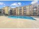 A beautiful outdoor swimming pool surrounded by the apartment building's facade at 711 Cosmopolitan Ne Dr # 347, Atlanta, GA 30324