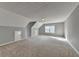 Large, carpeted bonus room with natural light from a double-hung window at 90 Ashford Dr, Oxford, GA 30054