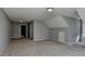 Bright bonus room with neutral carpeting, gray walls, white trim, and natural light at 90 Ashford Dr, Oxford, GA 30054