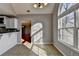 The breakfast nook is open to the kitchen and features a large window at 90 Ashford Dr, Oxford, GA 30054