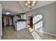 Bright dining area with gray walls open to kitchen and views to the hardwood floored formal dining room at 90 Ashford Dr, Oxford, GA 30054