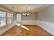 Elegant dining room featuring hardwood floors and stylish chandelier at 90 Ashford Dr, Oxford, GA 30054