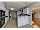 Kitchen with bar seating is open to multiple rooms in the house at 90 Ashford Dr, Oxford, GA 30054