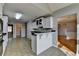 Kitchen with bar seating is open to multiple rooms in the house at 90 Ashford Dr, Oxford, GA 30054
