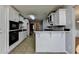 Kitchen with bar seating is open to multiple rooms in the house at 90 Ashford Dr, Oxford, GA 30054