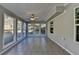Sunroom featuring multiple windows, tile flooring, and paneled ceiling at 90 Ashford Dr, Oxford, GA 30054