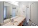 Bright bathroom featuring a large mirror, a window for natural light, and a clean, functional design at 1294 Park Pass Way, Suwanee, GA 30024