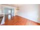 Bright dining room with hardwood floors and decorative chandelier for elegant entertaining at 1294 Park Pass Way, Suwanee, GA 30024