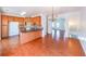 Spacious kitchen with wood cabinets, wood floors, and an island counter great for entertaining at 1294 Park Pass Way, Suwanee, GA 30024