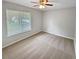 Cozy bedroom with neutral carpet, a window with blinds, and natural light at 245 Adena W Ln, Atlanta, GA 30349