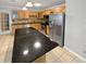 Well-lit kitchen featuring ample cabinetry, stainless steel appliances, a tile backsplash and large island at 245 Adena W Ln, Atlanta, GA 30349