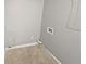 Functional laundry room with tile flooring and essential hookups, ready for appliances at 245 Adena W Ln, Atlanta, GA 30349