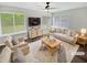 Bright living room with large windows, neutral decor, plush seating, and stylish furnishings at 245 Adena W Ln, Atlanta, GA 30349