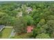 Aerial perspective of the home surrounded by lush greenery in a serene, tree-filled neighborhood at 3452 Ridgecrest Dr, Powder Springs, GA 30127