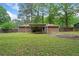 A spacious backyard with a covered patio and well-maintained lawn offers a serene outdoor retreat at 3452 Ridgecrest Dr, Powder Springs, GA 30127