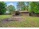 A brick home in a natural setting with a covered patio and expansive backyard at 3452 Ridgecrest Dr, Powder Springs, GA 30127