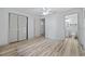 A bright bedroom leads to a bathroom, showcasing modern wood floors and ample closet space at 3452 Ridgecrest Dr, Powder Springs, GA 30127