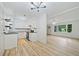 Stylish kitchen with white cabinetry, black countertops, and open layout at 3452 Ridgecrest Dr, Powder Springs, GA 30127