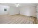 Open-concept living room with wood plank flooring and natural light at 3452 Ridgecrest Dr, Powder Springs, GA 30127
