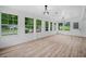 Bright and airy sunroom with large windows, wood plank flooring, and ample natural light at 3452 Ridgecrest Dr, Powder Springs, GA 30127