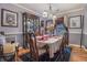 Elegant dining room with hardwood floors, chandelier lighting, and large china cabinet at 6436 Alpine Rd, Rex, GA 30273