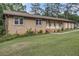 Ranch-style home with brick and grass lawn at 6436 Alpine Rd, Rex, GA 30273