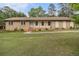 Charming ranch-style home featuring a brick facade and a well-manicured front yard at 6436 Alpine Rd, Rex, GA 30273