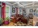 Inviting living room with hardwood floors, stylish furniture, and coffered ceilings at 6436 Alpine Rd, Rex, GA 30273