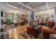 Open-concept living area with hardwood floors, seamlessly connecting to the dining space at 6436 Alpine Rd, Rex, GA 30273