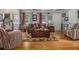Inviting living room with hardwood floors, stylish furniture, and coffered ceilings at 6436 Alpine Rd, Rex, GA 30273