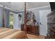 Inviting main bedroom with wood floors, dresser, and natural light at 6436 Alpine Rd, Rex, GA 30273