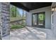 Back porch featuring stone column and french doors overlooking backyard at 1002 Coleman Sw St, Atlanta, GA 30310