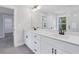 Stylish bathroom with double vanity, white cabinets, and views of the bedroom at 1002 Coleman Sw St, Atlanta, GA 30310
