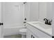 Bright bathroom with white subway tiles, modern vanity, and sleek fixtures at 1002 Coleman Sw St, Atlanta, GA 30310