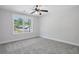 Light-filled bedroom with plush carpet, large window, and calming neutral tones at 1002 Coleman Sw St, Atlanta, GA 30310