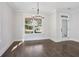 Bright dining room with hardwood floors and a view of the front yard at 1002 Coleman Sw St, Atlanta, GA 30310