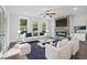 Bright living room with stone fireplace, modern furniture, hardwood floors, and lots of natural light at 1002 Coleman Sw St, Atlanta, GA 30310