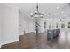 Spacious open floorplan with a kitchen island, staircase, and large windows, perfect for modern living at 1002 Coleman Sw St, Atlanta, GA 30310