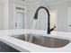 Close-up of the kitchen sink with stainless steel finish and modern faucet at 1002 Coleman Sw St, Atlanta, GA 30310