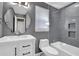 Modern bathroom boasts tiled shower, vanity with storage, and unique mirror at 2008 Falcon Glen Ct, Alpharetta, GA 30022