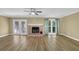 View of a living room showcasing french doors and a brick fireplace at 2008 Falcon Glen Ct, Alpharetta, GA 30022